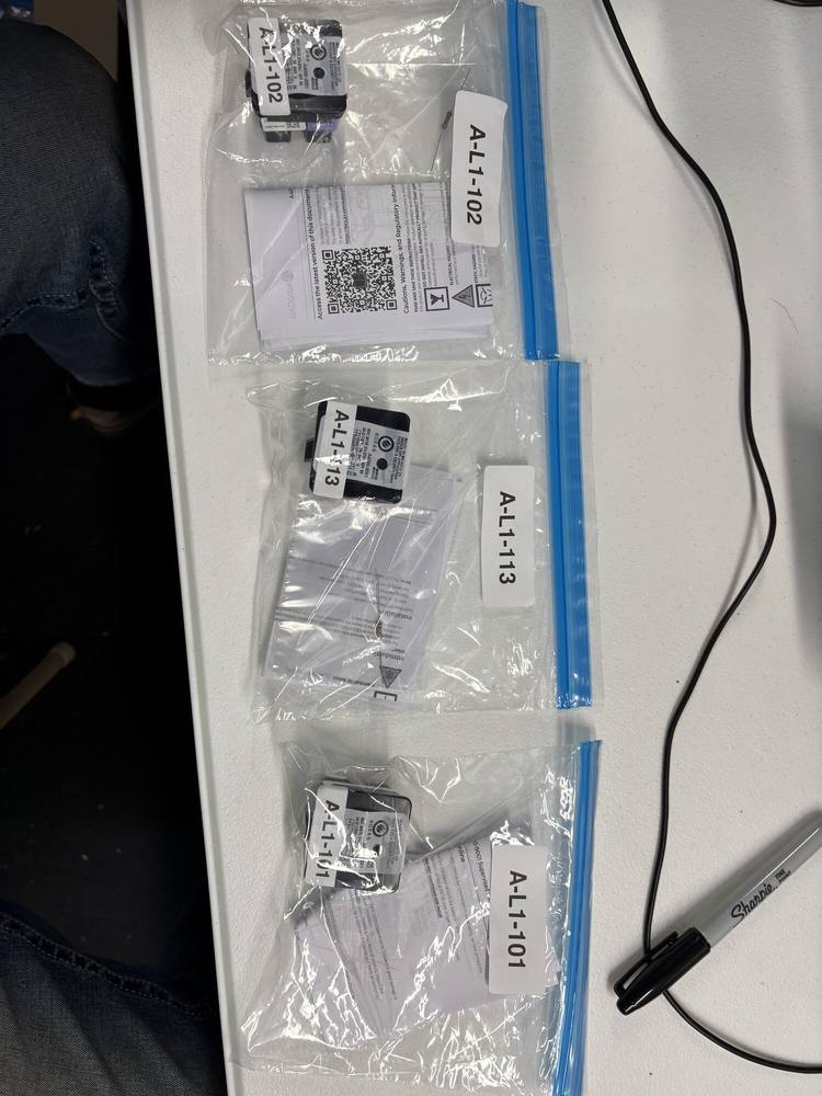 Three addressable modules, each sealed in its own bag with a printed address label reading A-L1-102, A-L1-113 and A-L1-101.